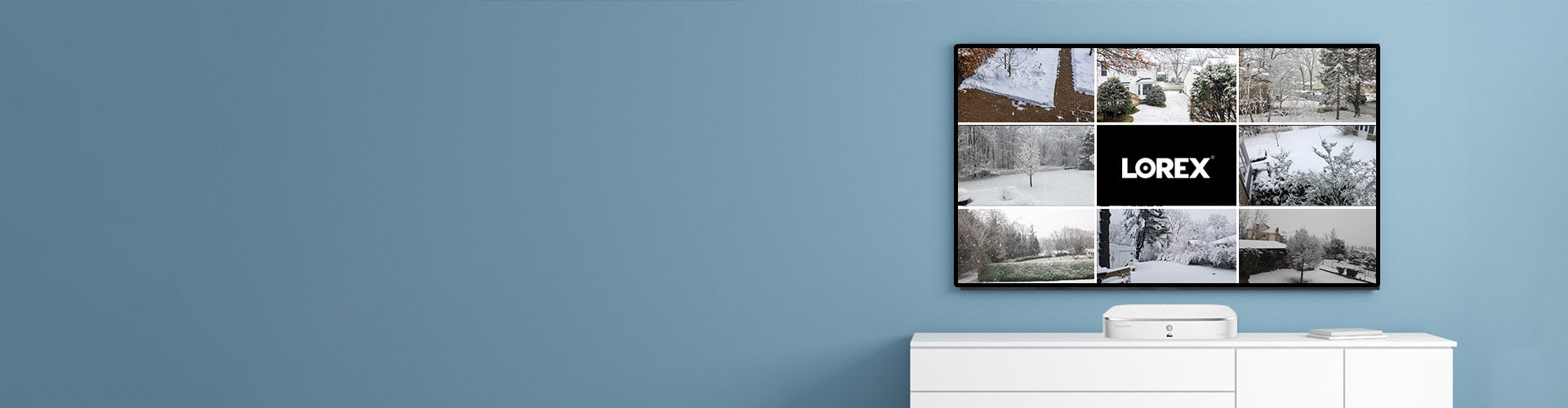Wall-mounted display showing snowy outdoor views captured by an IP camera system with a Network Video Recorder.