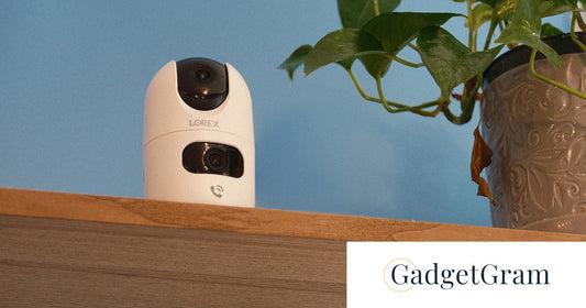 Lorex Connect 2K Dual-Lens Indoor Camera displayed on a shelf beside a potted plant, featured in GadgetGram's review of its smart indoor monitoring capabilities.