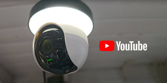 Lorex 2K lightbulb Wi-Fi camera installed in a ceiling socket with YouTube logo, highlighting easy home monitoring and video tutorials.