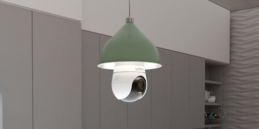 Lorex 2K lightbulb security camera installed in a pendant light fixture within a modern kitchen