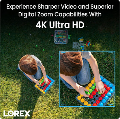Aerial view of two children on a grassy yard playing with a colorful learning board, Lorex logo and 4K Ultra HD promo text.