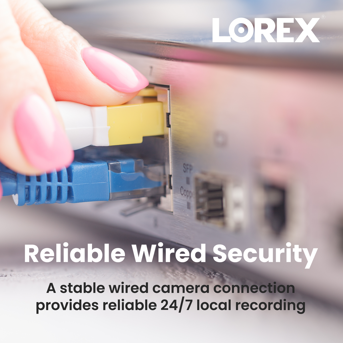 Close up of a hand installing a hard drive into Lorex hardware with exposed circuitry and connectors