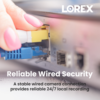 Close up of a hand installing a hard drive into Lorex hardware with exposed circuitry and connectors
