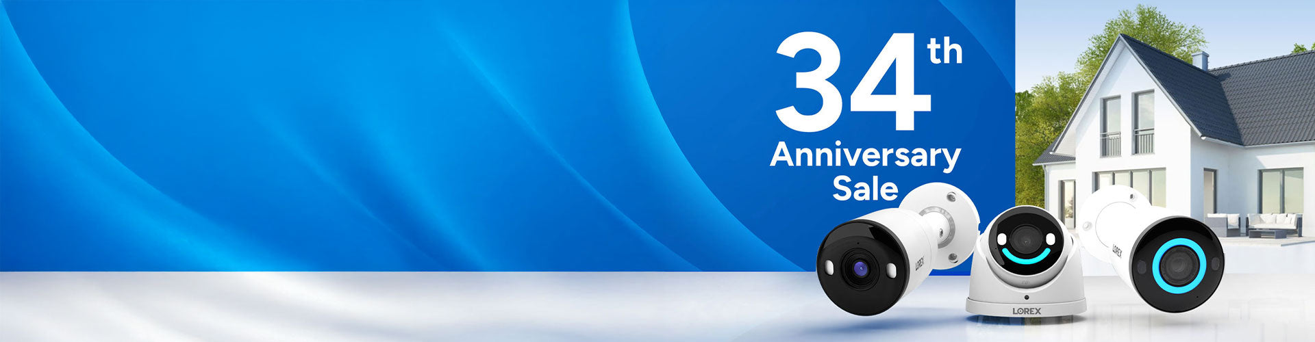 Lorex 34th Anniversary Sale banner featuring three Lorex security cameras in front of a modern house, promoting discounts on home security systems.