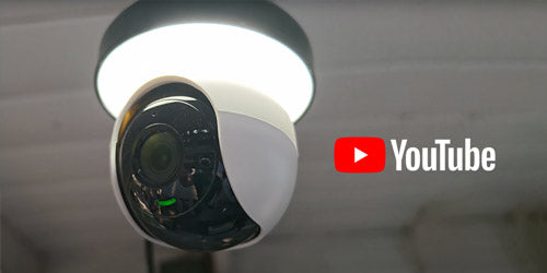 Lorex 2K lightbulb Wi-Fi camera installed in a ceiling socket with YouTube logo, highlighting easy home monitoring and video tutorials.